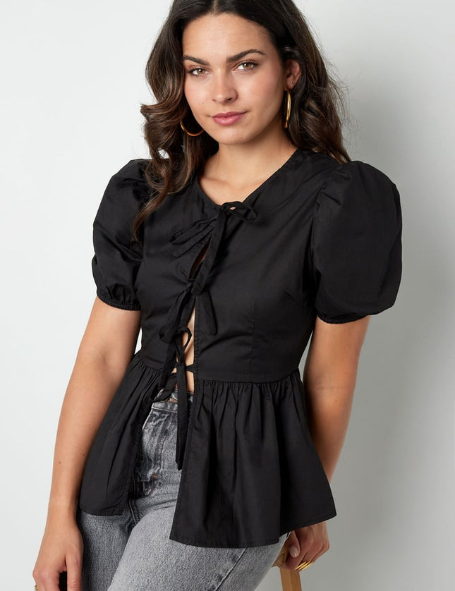 Blouse incontournable à basque et nœuds