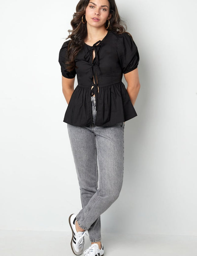 Blouse incontournable à basque et nœuds