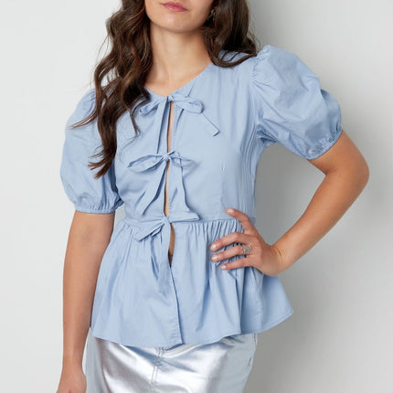 Blouse incontournable à basque et nœuds