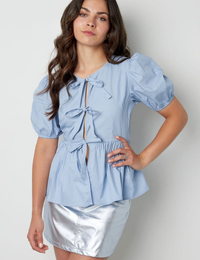 Blouse incontournable à basque et nœuds