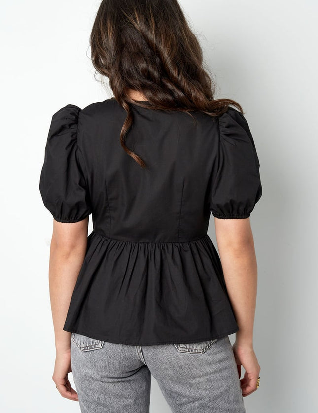 Blouse incontournable à basque et nœuds